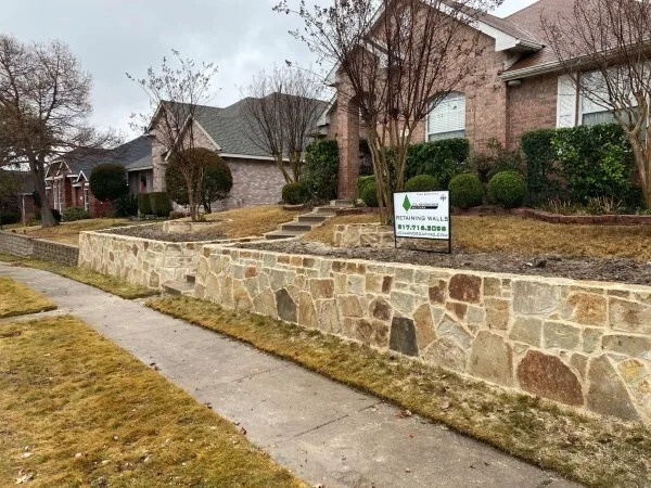 Retaining Wall in Allen Texas Replaced cross tie retaining wall with Milsap stone