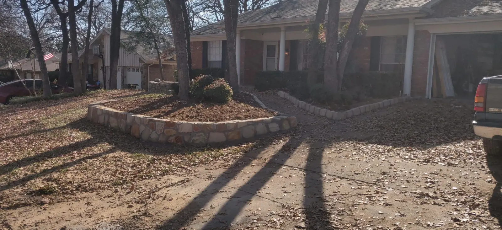 Replaced cross tie retaining wall with Milsap stone in Carrolton
