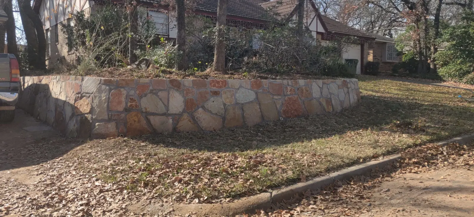 Replaced cross tie retaining wall with Milsap stone in Carrolton