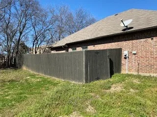 Before Installed milsap stone wall to level out side yard to support foundation Lake Dallas Texas Before Installed milsap stone wall to level out side yard to support foundation Lake Dallas Texas