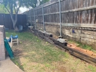 Before Replaced cross ties with Milsap stone retaining wall in Euless Texas