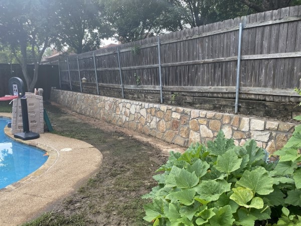 Replaced cross ties with Milsap stone retaining wall in Euless Texas