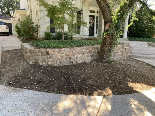 Replaced old block retaining wall with moss rock boulders in Fort Worth (2)-min Replaced old block retaining wall with moss rock boulders in Fort Worth (2)-min
