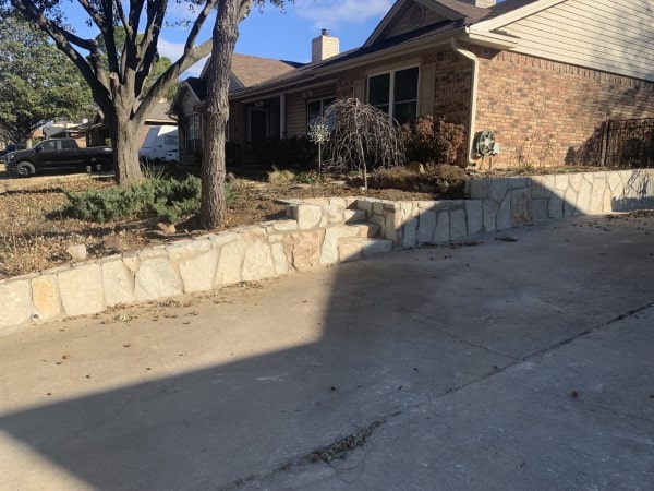 Replaced crosstie wall with milsap stone in Euless