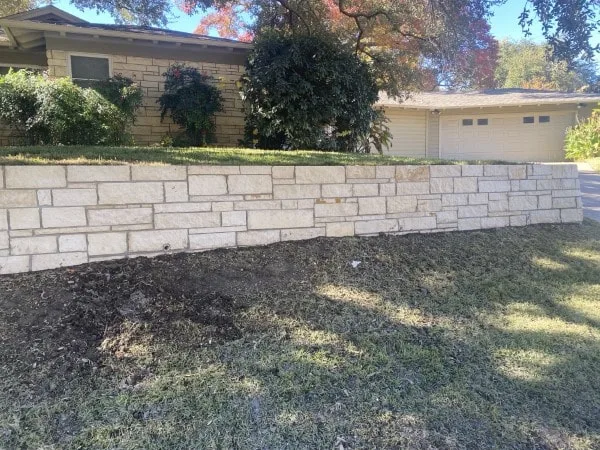 New wall to level outside of home in Fort Worth using sawed Austin Stone (1)