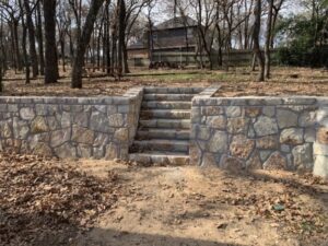 Replaced a wood retaining wall with a Millsap Stone in Burleson (1)