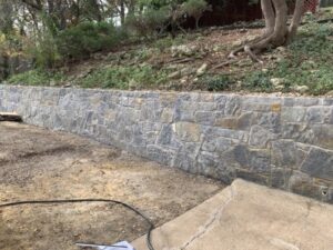 Replaced failing wood wall in Fort Worth with Stonewall. stone is called Silver Mist Hackett (1)-min