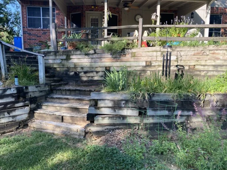 Retaining wall base and drainage under construction in Arlington, TX