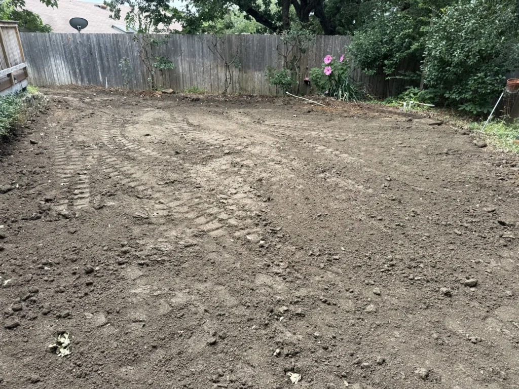 Backyard in Bedford, TX cleared and graded level after pool removal by DFW Retaining Walls and Pool Demo